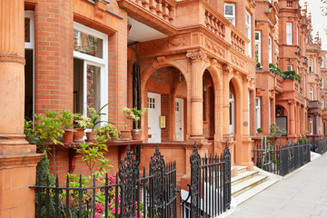 Row of red bricks houses in London, english architecture