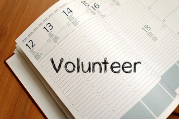 Volunteer write on notebook