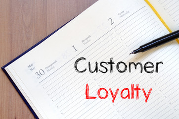 Customer loyalty write on notebook