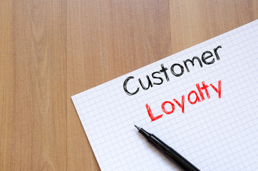 Customer loyalty write on notebook