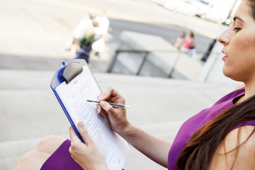 Young Woman Fills Out Survey