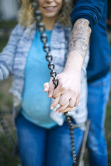 Young pregnant couple on the spring