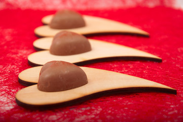 Obraz na płótnie Canvas chocolate candy on a wooden board