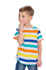Pensive little boy looks aside