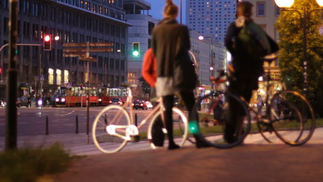 Group of young people with bikes in city