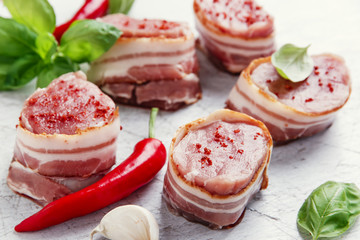 raw Pork tenderloin medallions with bacon wrapped