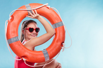 Happy woman in sunglasses with ring buoy lifebuoy.