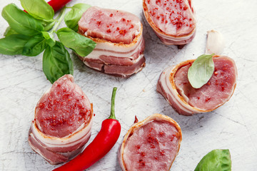 raw Pork tenderloin medallions with bacon wrapped