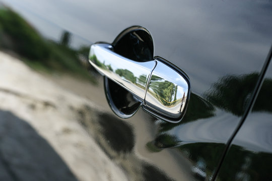 Car door handle close up photo © Maksim Kostenko
