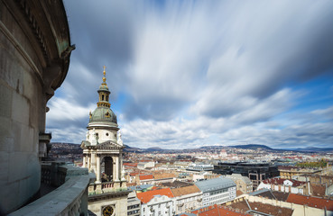 Fototapeta na wymiar Budapest skyline from the top of St. Stephen's Basilica with moving clouds - Budapest, Hungary