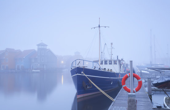 ship on harbor in dense fog