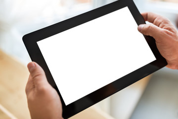 Man hand touching screen on modern tablet pc. Close-up image wit