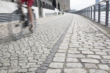 Cyclist on the Embankment of the River Spree, Berlin