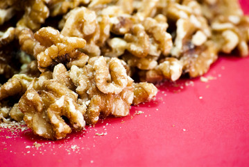 Nuts isolated on red background.