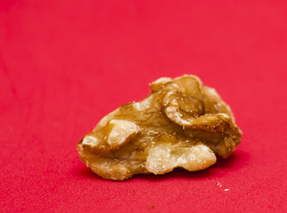 Nuts isolated on red background.