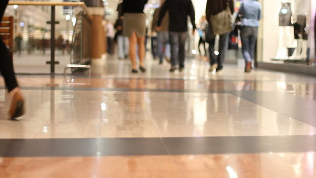 Shopping mall shoppers walk in the aisle 1