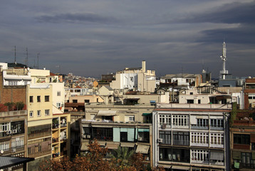 Fototapeta premium BARCELONA, CATALONIA, SPAIN - DECEMBER 13, 2011: Multi-storey buildings and roofs in Barcelona