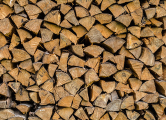 Firewood stacked in a row. Front view.
