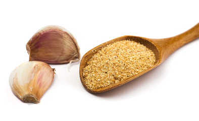 Garlic in wooden spoon