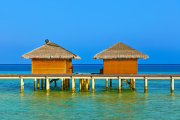 Bungalows on tropical Maldives island
