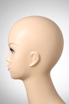 Mannequin head on grey background