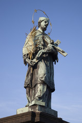 Fototapeta na wymiar Statue of John of Nepomuk by Rauchmiller (1863), Charles Bridge,