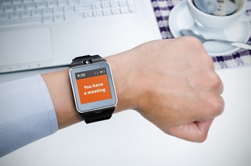Businessman working with smart watch in restaurant