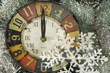 Fototapeta na wymiar Vintage clock for New years eve and snowflakes