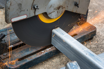 Cutting a square metal and steel with compound mitre saw with cicular blade