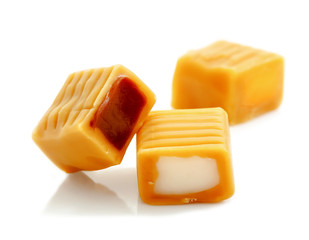 toffee caramel candy with chocolate and cream filling isolated on white background