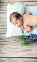 Cute little child sleeping on the blanket