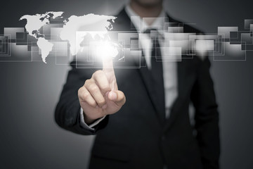 Close up of businessman touching digital screen with finger