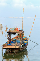 Fototapeta na wymiar Small Fisherman Boat with Traditional Fishing Tools, Thailand