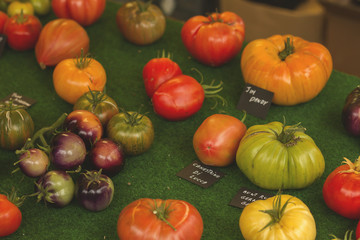 different varieties of  ecological bio tomatoes in a market