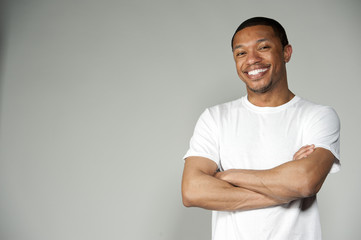 Trendy Happy and Fun Black Male Wearing A White Top