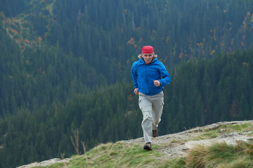 Fototapeta premium advanture man with backpack hiking