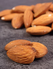 Heap of almonds on concrete structure