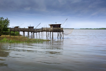 Fototapeta na wymiar Fisherman huts on the river