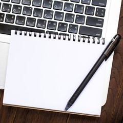 Notebook an address book with blank sheets and calculator on the