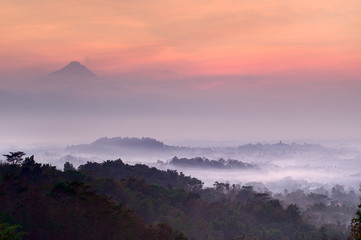 Pre-dawn at Setumbu hill with the view of Borobudur and  Merapi