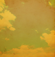 Blue sky with clouds in grunge and retro style.