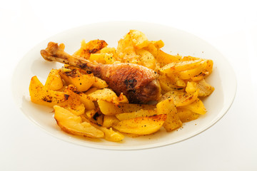 Tasty meal in a plate, baked chicken and patatoes