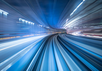 Motion blur of train moving inside tunnel in Tokyo, Japan - obrazy, fototapety, plakaty