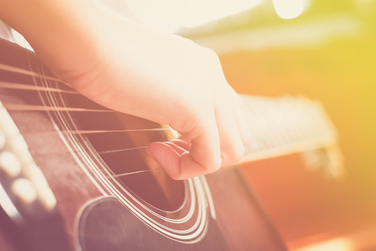 girl playing guitar