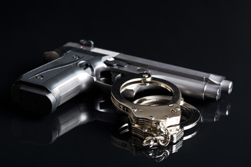 handcuffs and handgun