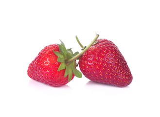 Two strawberries close up on white background