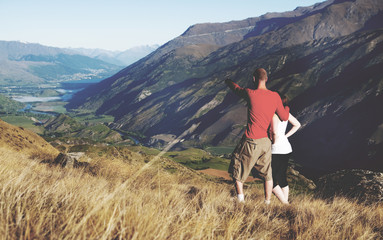 Couple Looking Afar Mountain And Lake Concept