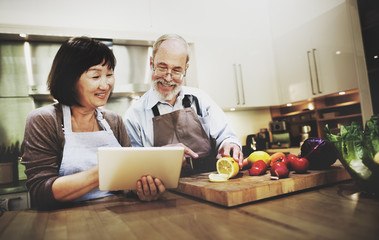 Husband Wife Cooking Searching Menu Tablet Concept