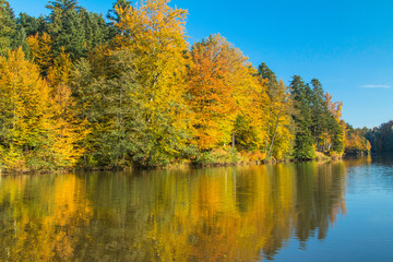 Fototapeta na wymiar Reflection of trees on Trakoscan lake in Zagorje, Croatia, season, autumn