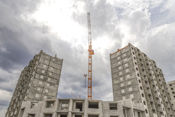 Fototapeta na wymiar Hoisting tower cranes